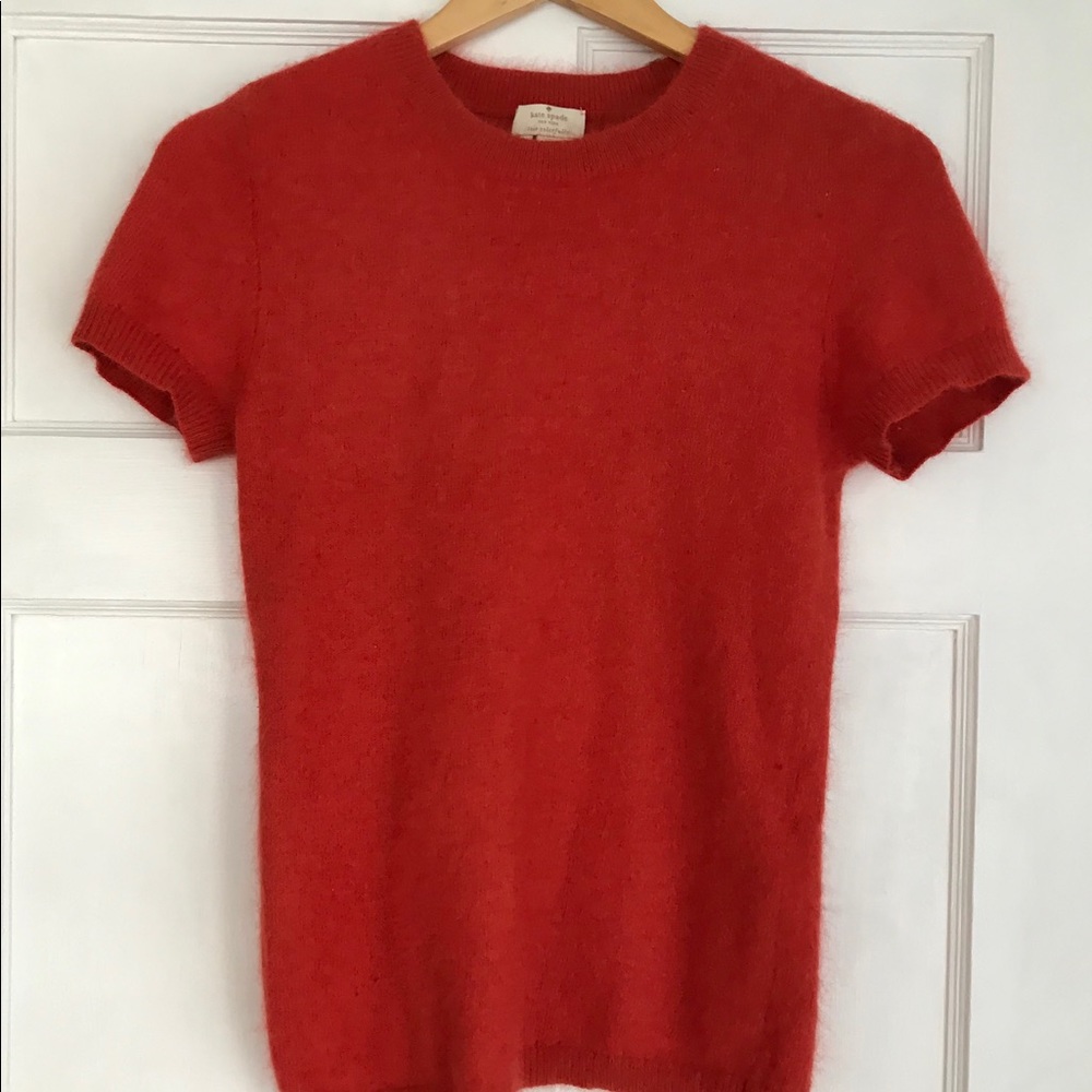 Kate Spade short sleeve warm orange sweater.